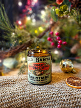 Load image into Gallery viewer, Christmas Spice Vintage Vegan Candle in an amber glass jar with a vintage Santa label and festive red, green and cream artwork.