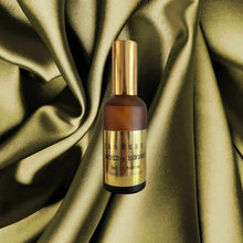 Load image into Gallery viewer, BORNEO Eau De Parfum 100ml bottle with gold label on green satin fabric background