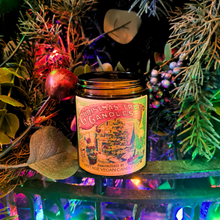 Load image into Gallery viewer, Christmas Tree Candle Vintage Vegan in a clear glass jar with a black lid and colorful vintage Christmas tree label.