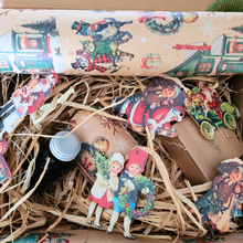 Load image into Gallery viewer, Nostalgic Christmas candle hamper box with vintage candle, diffuser, wax melt, and festive decorations wrapped in hessian ribbon and metallic sash