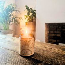 Load image into Gallery viewer, Welsh Candle Daffodil scented soy wax vegan candle with historic newspaper gift wrap