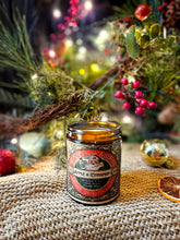 Load image into Gallery viewer, Apple and Cinnamon Vintage candle in an amber glass jar with an ornate red and cream vintage label and botanical artwork.
