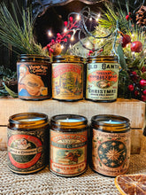 Load image into Gallery viewer, Spiced Orange Candle in a glass jar with a vintage orange-and-black Christmas label and decorative typography.
