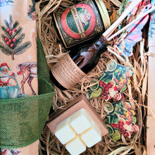 Load image into Gallery viewer, Christmas candle hamper box with vintage candle, mini diffuser, wax melts, and festive decorations in straw packaging
