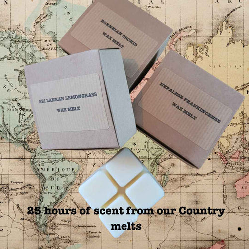 Wax melts in kraft boxes with assorted scents and long burn time displayed on a vintage map background